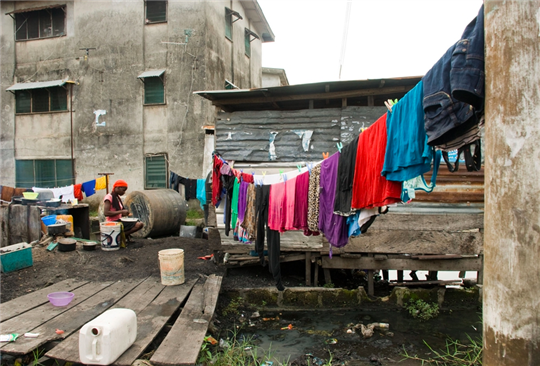 Woman with laundry on clothesline 