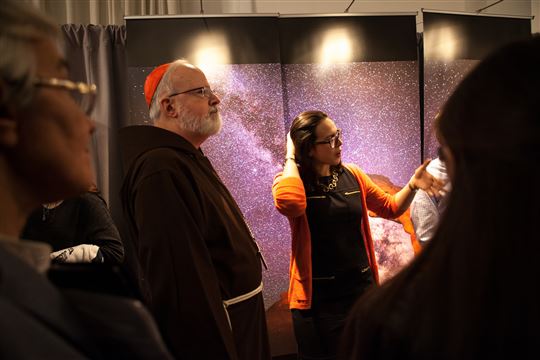 Cardinal Sean O'Malley visits the Millennial exhibit. Photo by Emily Marsolek