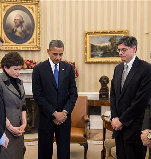 The President and others observe a moment of silence in the Oval Office, following the Sandy Hook shooting. Photo by Pete Souza via Wikimedia Commons