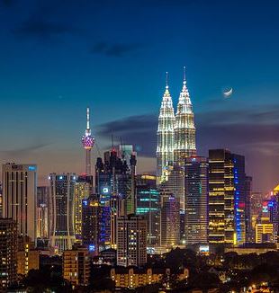Moonrise over Kuala Lumpur. Photo via Flickr
