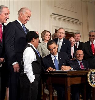 Barack Obama signs the Patient Protection and Affordable Care Act at the White House. Via Wikimedia Commons