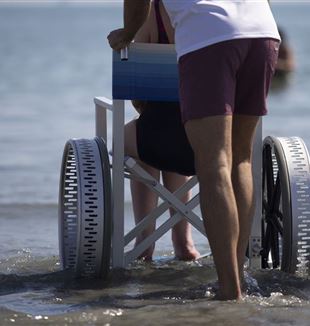 A disabled person on the beach at Punta Marina Terme (Ravenna)